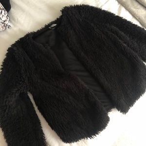 black furry sweater/jacket
